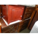 A 3 drawer chest, a pair of matching bedside chests and a linen bin.