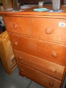 A 2 over 3 oak chest of drawers,.