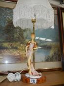 A 1930's style lady figurine table lamp.