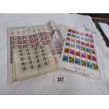 A quantity of sheets of stamps.