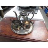 A 3 piece silver plate tea set on tray.