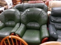 A green leather three piece suite.