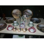 A shelf of miscellaneous ceramics including collector's plates.
