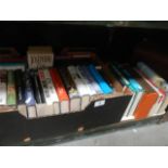 A shelf of mainly hardback books.
