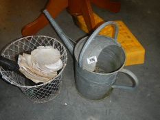 A galvanised watering can etc.