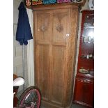 An arts and crafts oak wardrobe,