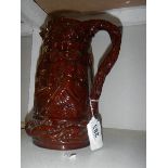 A Victorian treacle glazed jug,