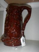 A Victorian treacle glazed jug,