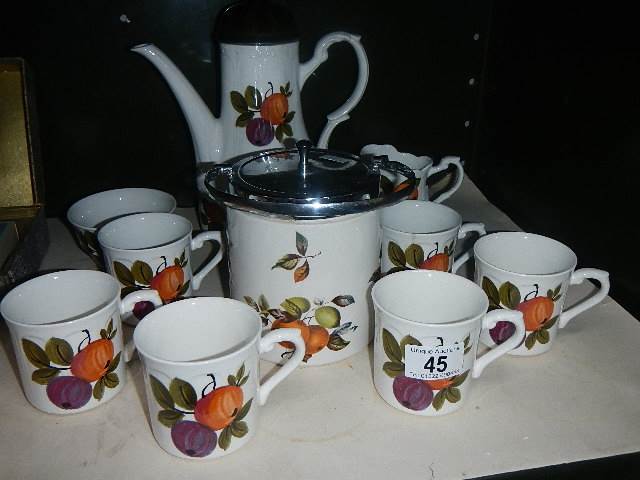 A coffee set and a biscuit barrel.