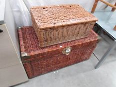 A wicker linen box and a picnic basket.