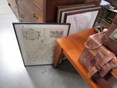A quantity of framed and glazed maps.