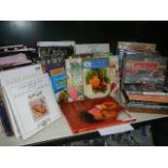 A shelf of assorted cookery books.