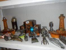 A mixed lot of transport related novelty lighters including ships, lighthouses, trains,