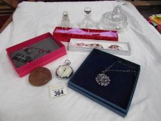 A small quantity of costume jewellery, glass scent bottles, stopwatch etc.