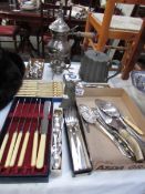 A mixed lot of cutlery, pewter teapot, sugar sifter etc.