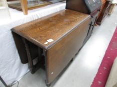 An oak gate leg table.