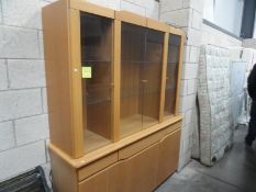 A pine effect display cabinet