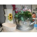 A vase, a planter and a large cup & saucer planter.