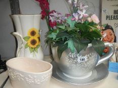 A vase, a planter and a large cup & saucer planter.