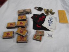 A mixed lot including brass buttons, cloth badges etc.