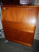 A teak bureau.