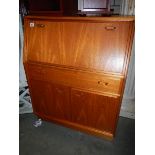 A teak bureau.