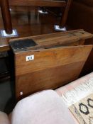 An old oak folding school desk.