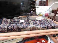 A blue patterned rug.