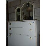 A white 3 drawer chest and mirror.