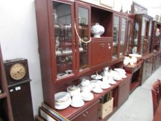 A mahogany effect wall unit,