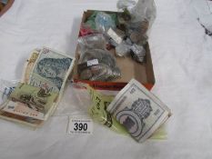 A mixed lot of foreign coins and bank notes including German, India, Russia, Switzerland, Italy etc.