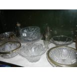 A shelf of assorted glass ware.