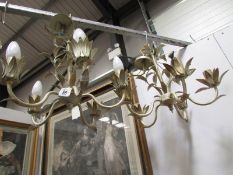 A pair of wrought iron ceiling lights.