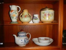 A teapot, biscuit barrel and other ceramics.