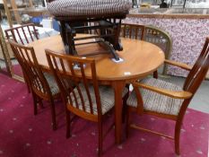 A teak dining table and 6 chairs.