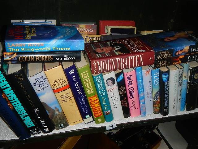 A shelf of hardback books.