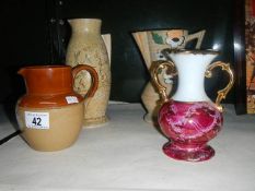 3 vases and a stoneware jug.