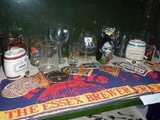 A shelf of Brewery related items.