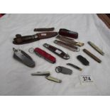 A quantity of old pen knives including sheath knife.