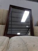 A mahogany framed mirror.