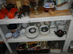 3 shelves of assorted kitchenware.