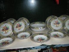 A large fruit bowl and 18 matching smaller bowls.