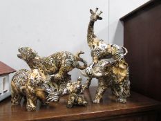 5 decoupage/collage style ceramic wild animal figurines including giraffe, cheetah, elephant etc.