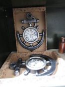 2 new and boxed clocks in the shape of anchors.