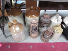 5 stone ware flagons including Innes's Ltd., of Derby and 3 lamps.