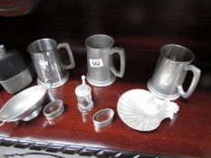 9 items of pewter including tankard, hip flask, shell dish etc.