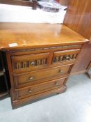 An oak 2 over 2 chest of drawers.