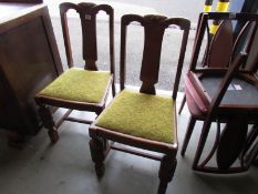 A pair of dining chairs,.