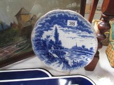 A 19th century blue and white plate with angling scene.