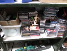 A shelf of CD's and cassette's.